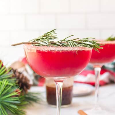Christmas cranberry cocktail in glass.