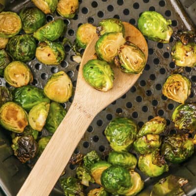 Brussels sprouts in air fryer basket.