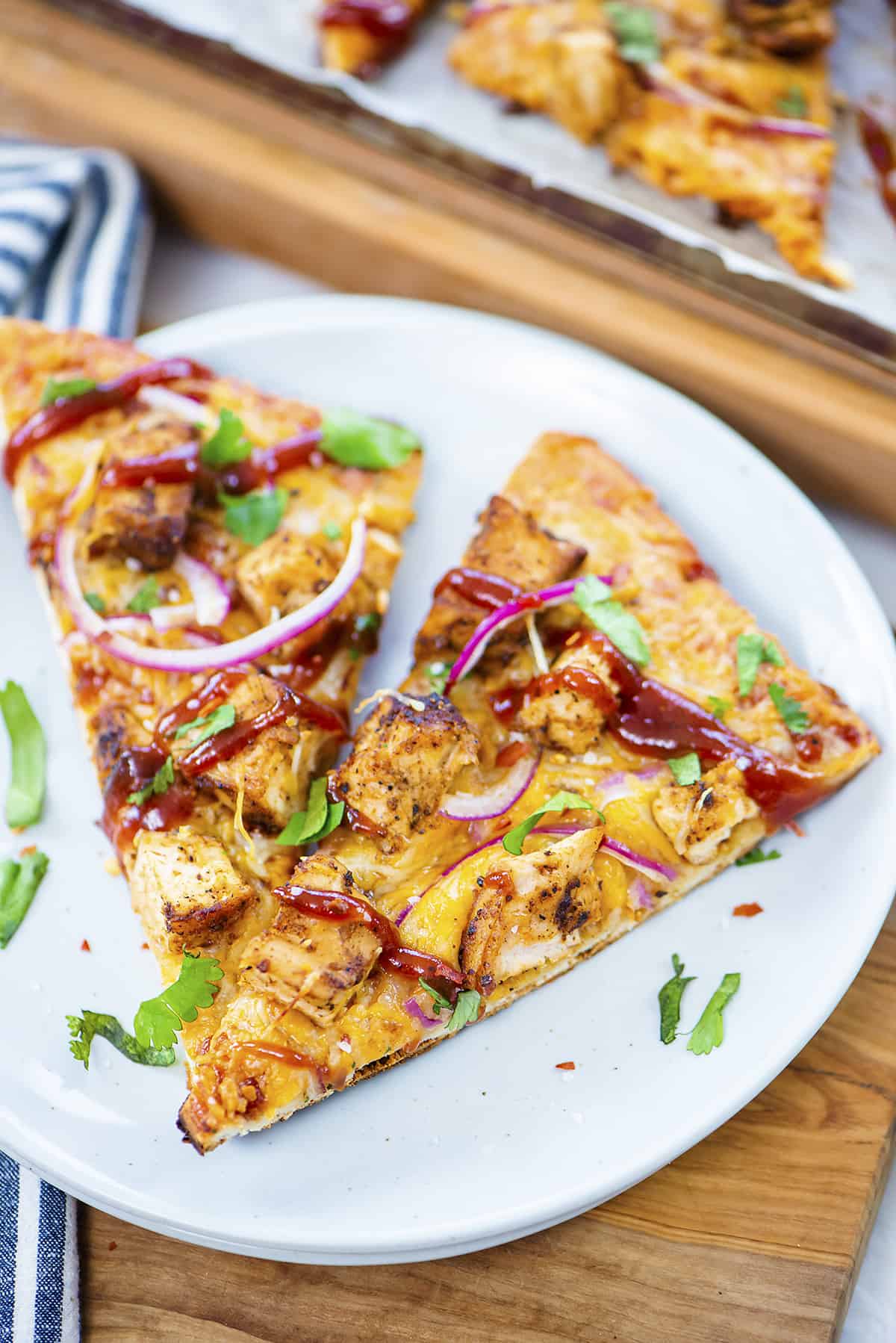 White plate with two slices of flatbread pizza.
