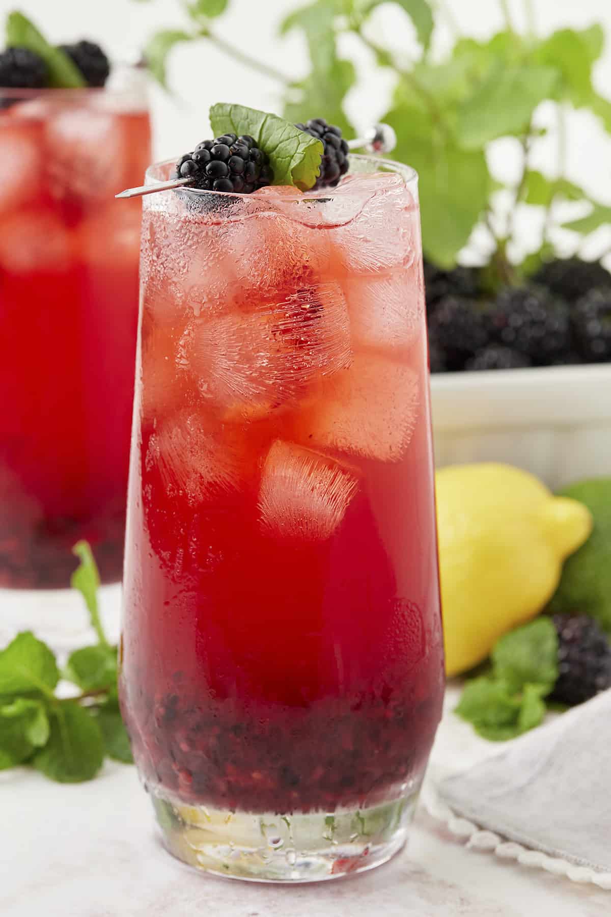 Blackberry mojito in tall glass.