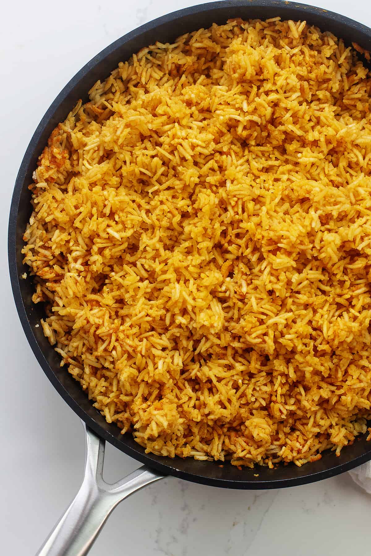 Overhead view of Mexican rice in skillet.