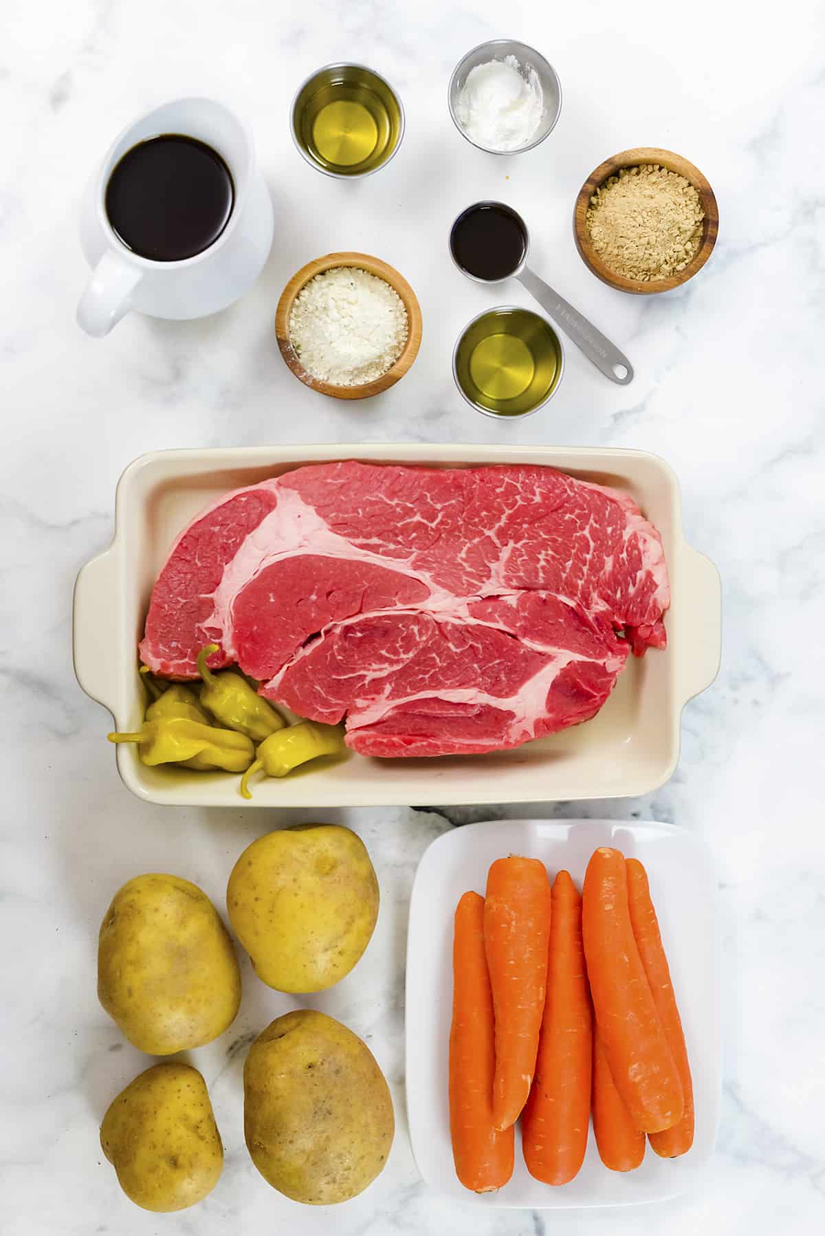 Ingredients for Mississippi pot roast with potatoes and carrots.