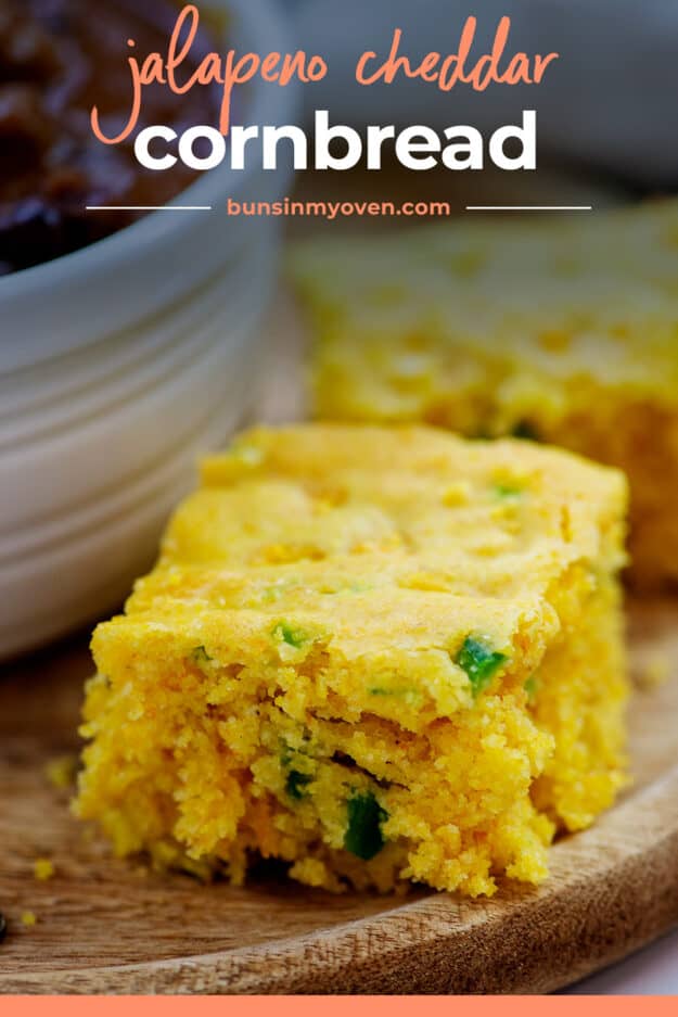 Cornbread slice on wooden board.