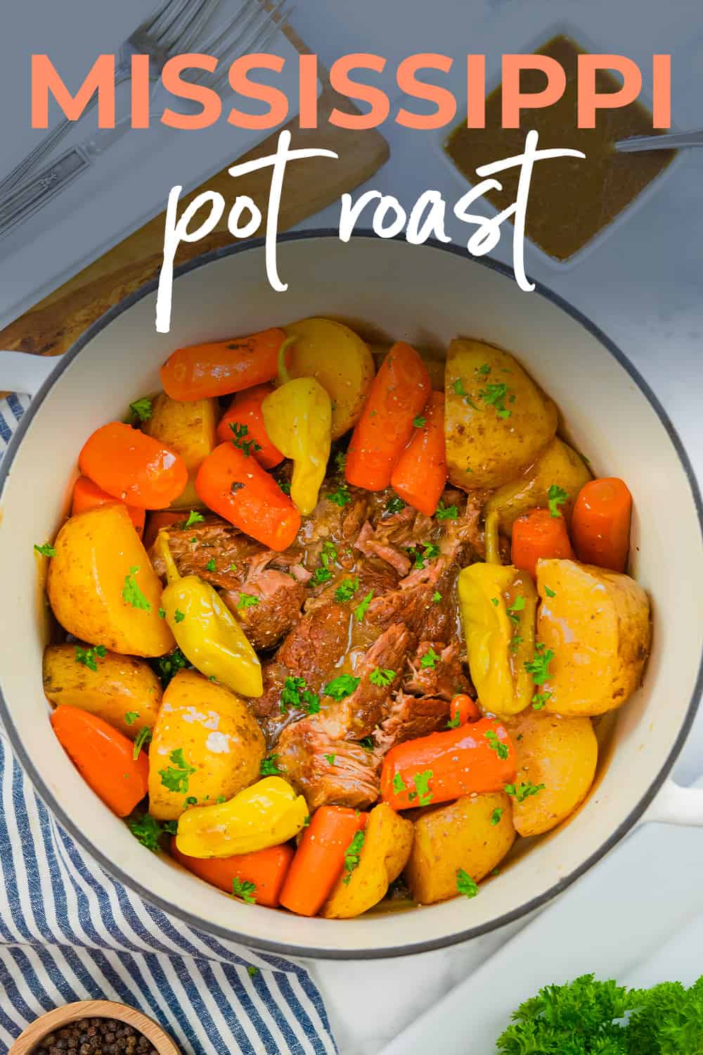 Mississippi roast with potatoes and carrots in dutch oven.