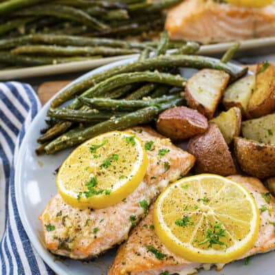 Roasted salmon, green beans, and potatoes on plate.