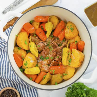 Pot roast with vegetables in dutch oven.