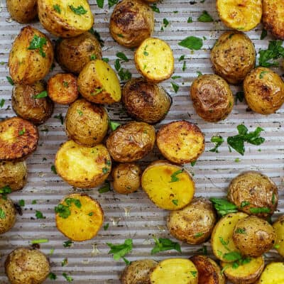 Overhead view of roasted potatoes on sheet pan.
