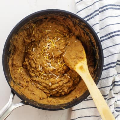 Refried beans in black pot.