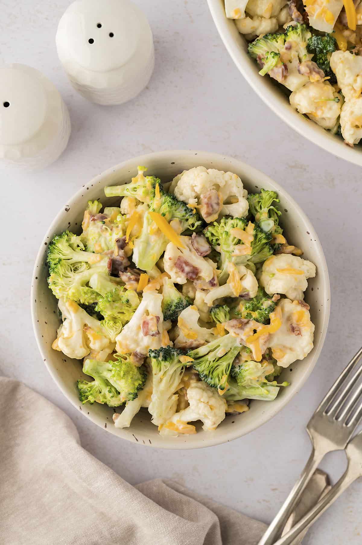 Amish broccoli salad in small white bowl.
