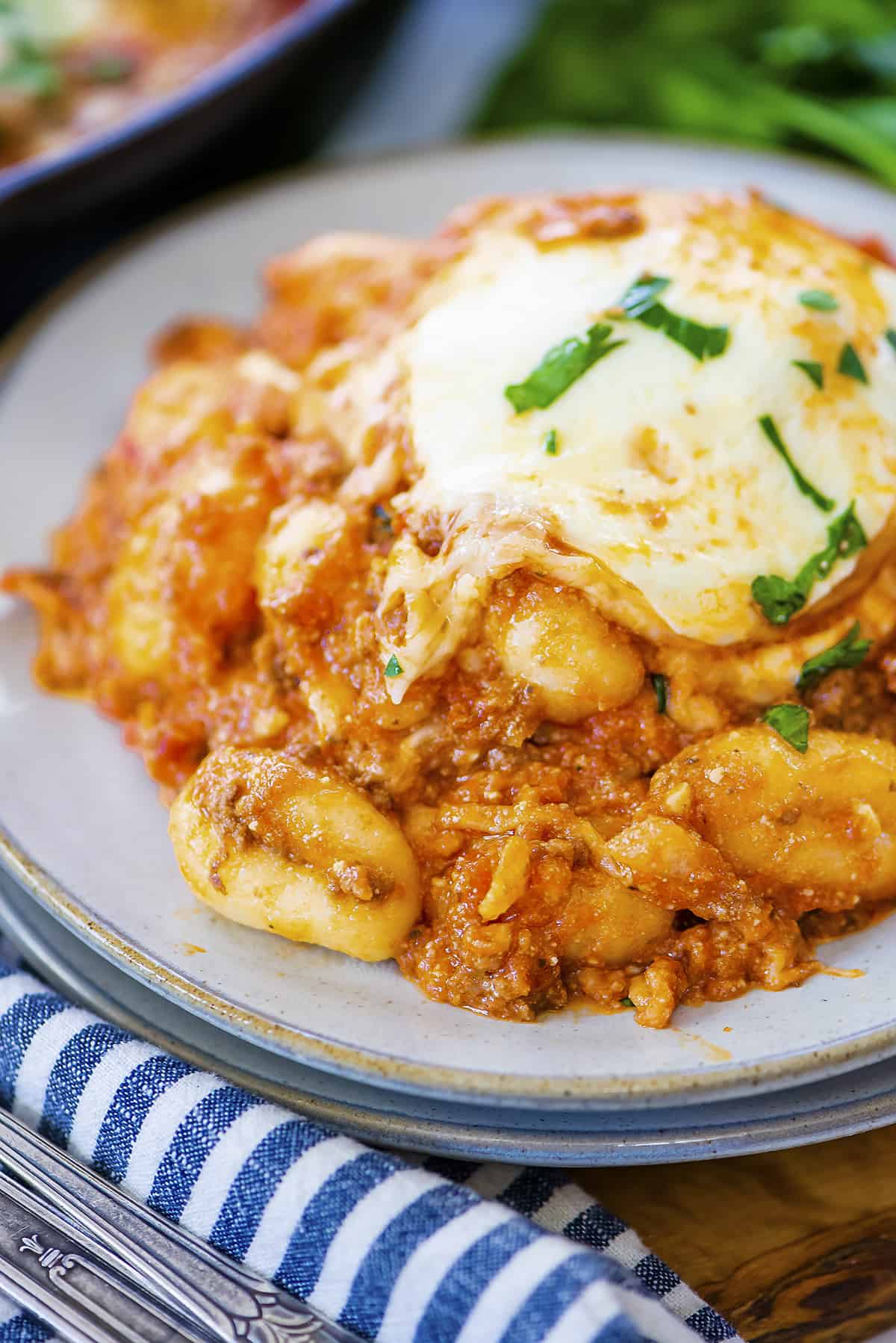 Plate full of baked gnocchi.