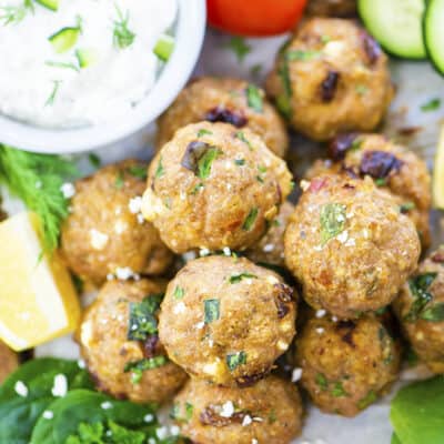 Overhead view of turkey meatballs on platter with tzatziki.