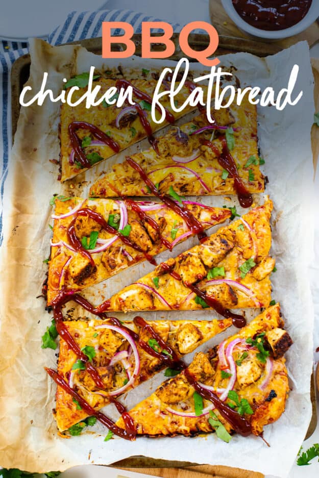 Flatbread topped with BBQ chicken on baking sheet.