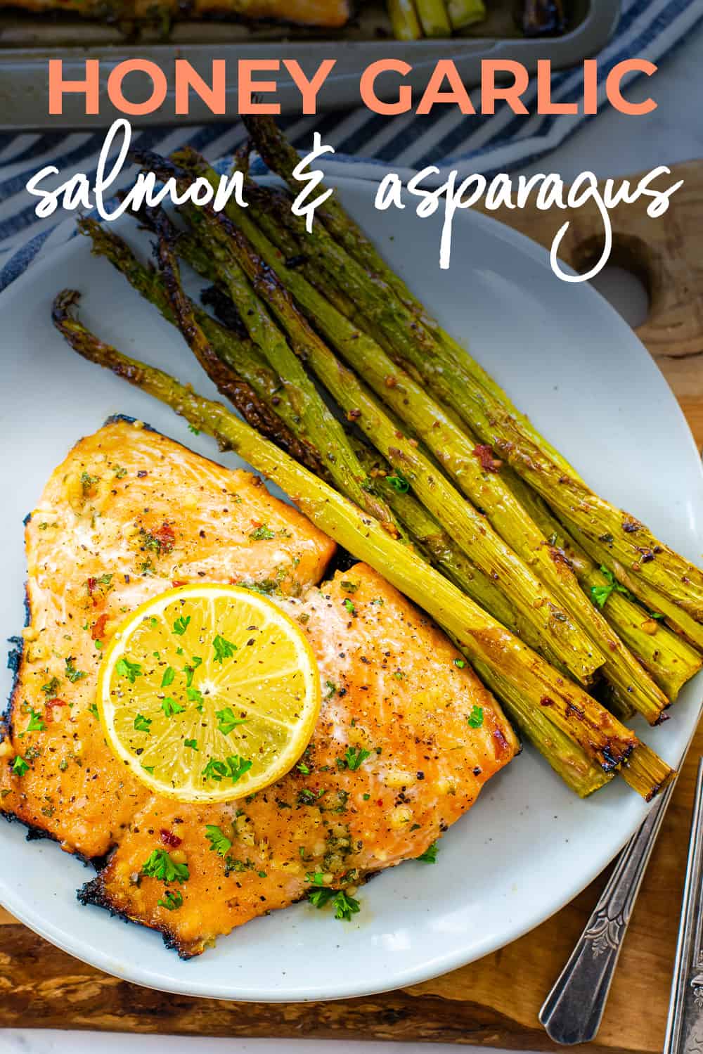 Salmon and asaparagus on white plate.