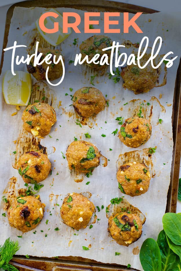 Baked greek turkey meatballs on sheet pan with text for PInterest.