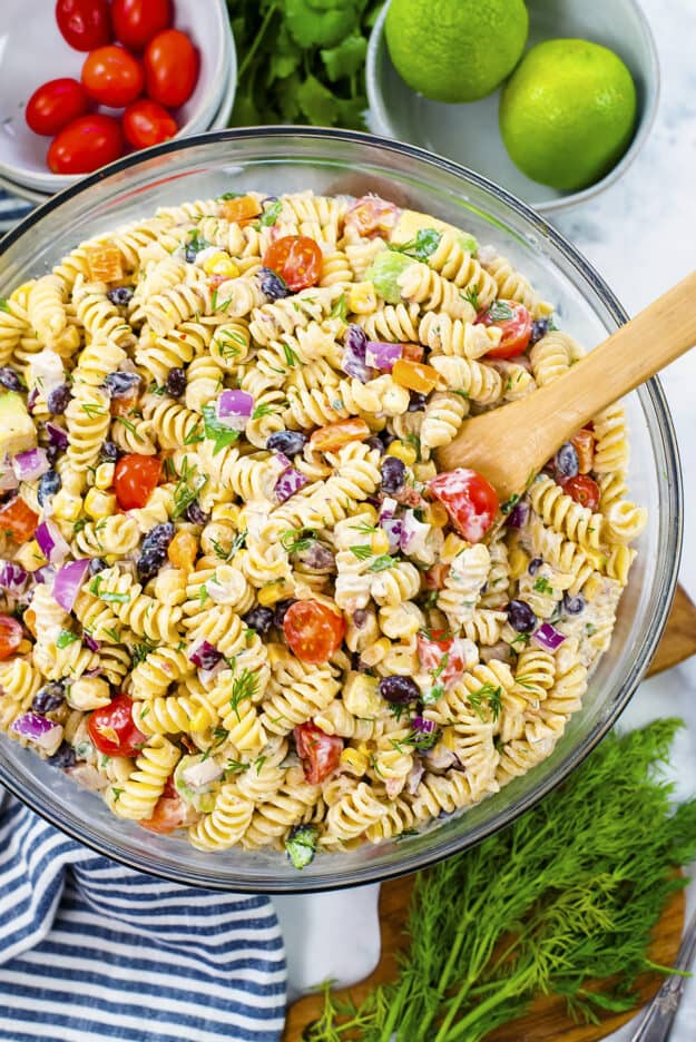 Overhead view of Southwest pasta salad in glass mixing bowl.