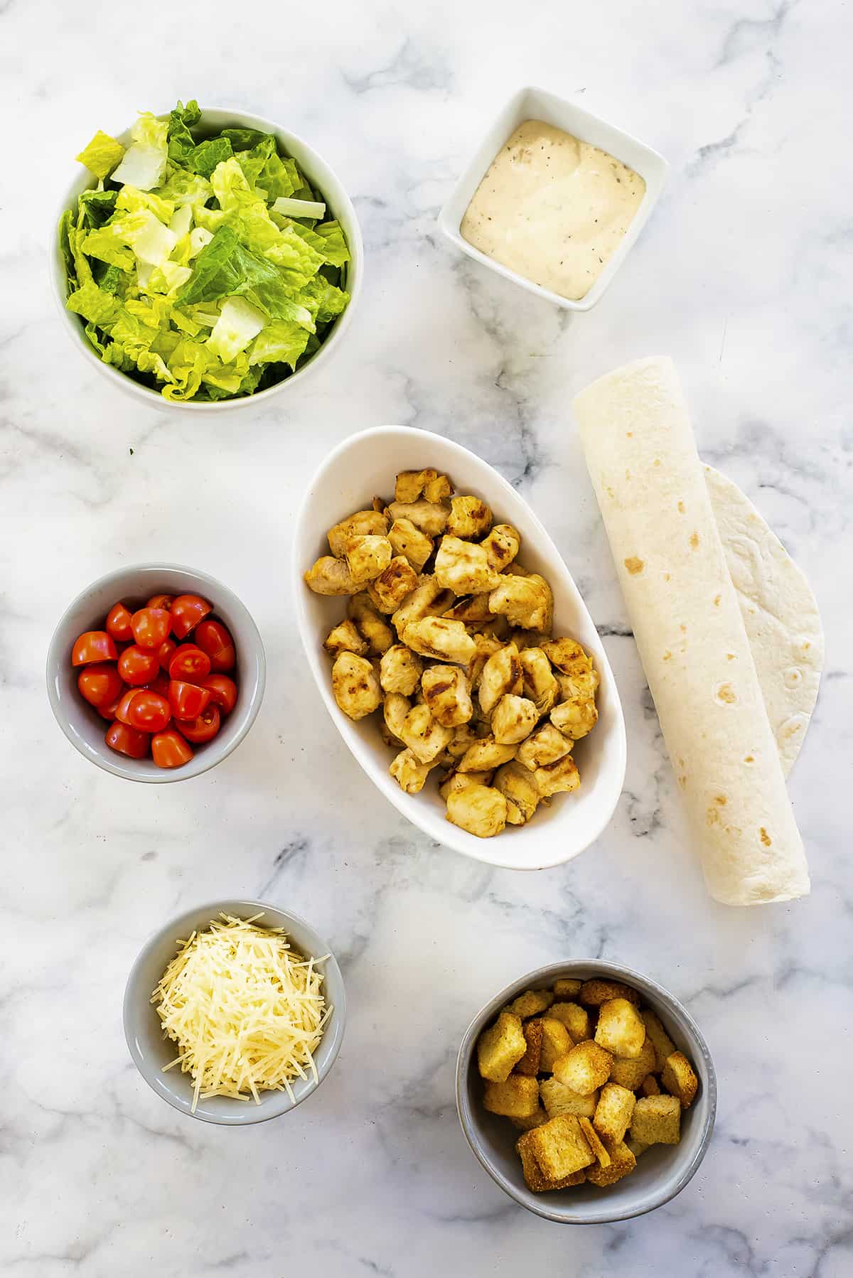 Ingredients for chicken Caesar wraps.