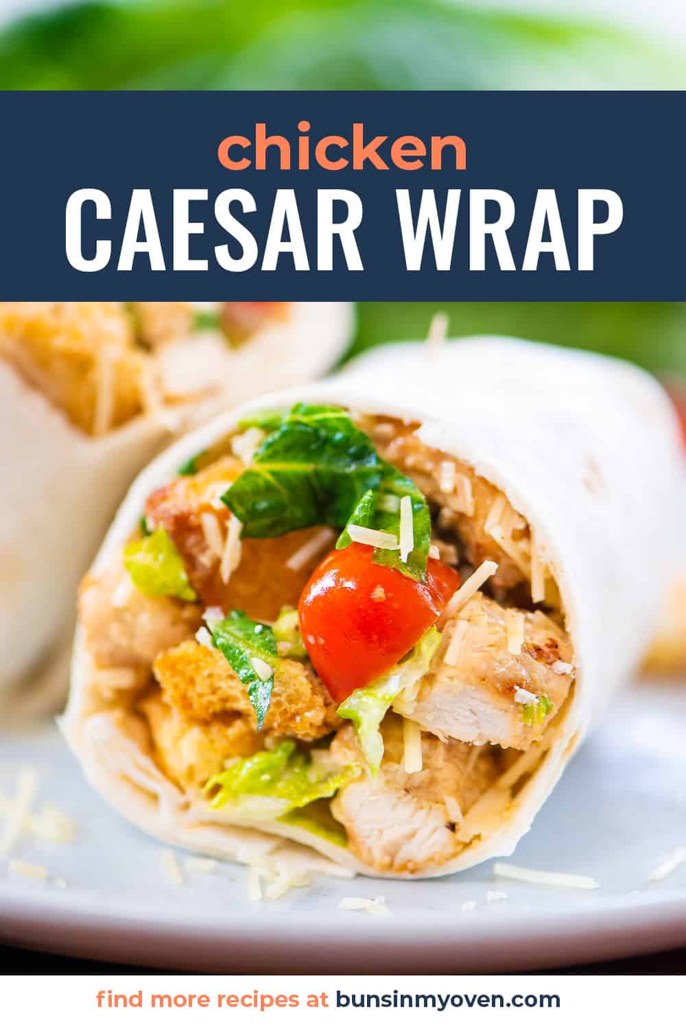 Chicken Caesar wrap on white plate.