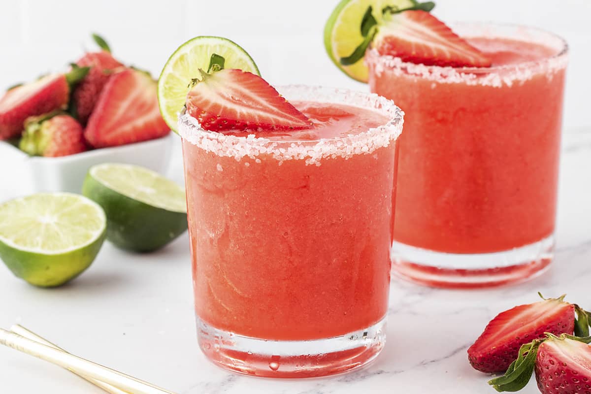 Frozen strawberry margaritas in glasses.