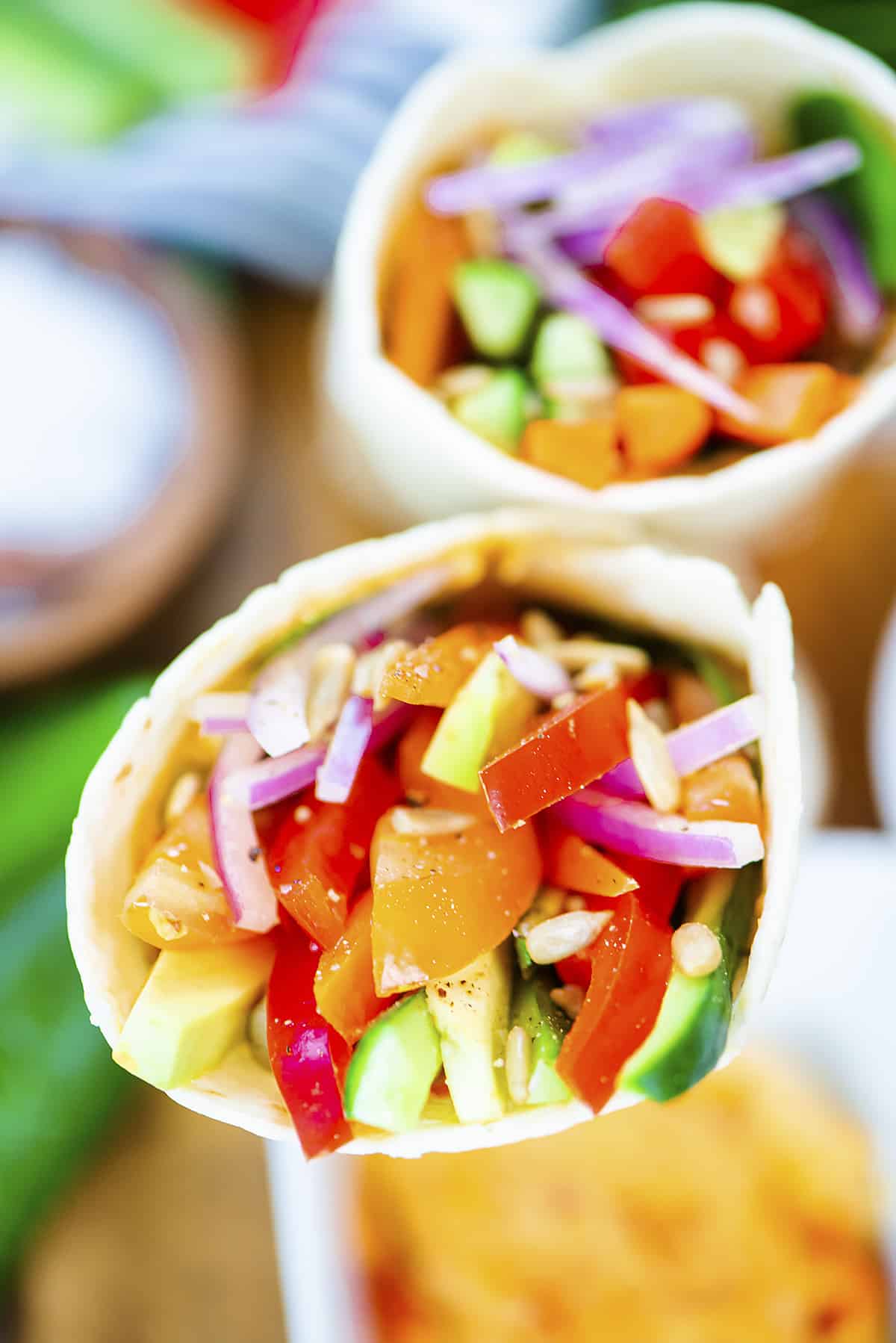 Hummus wraps filled with vegetables.
