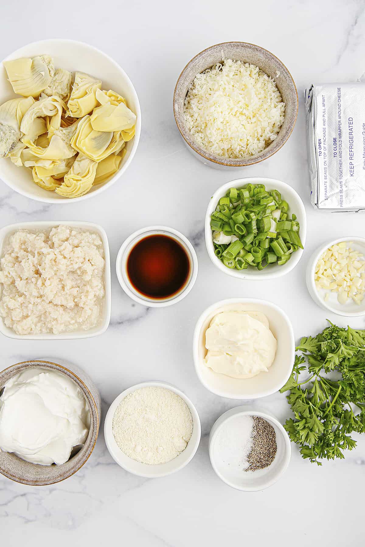 Ingredients for artichoke crab dip.