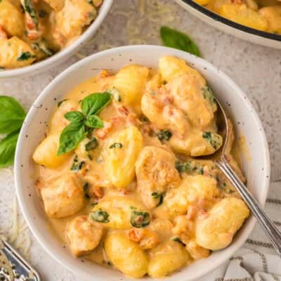 Bowl full of Tuscan chicken and gnocchi.