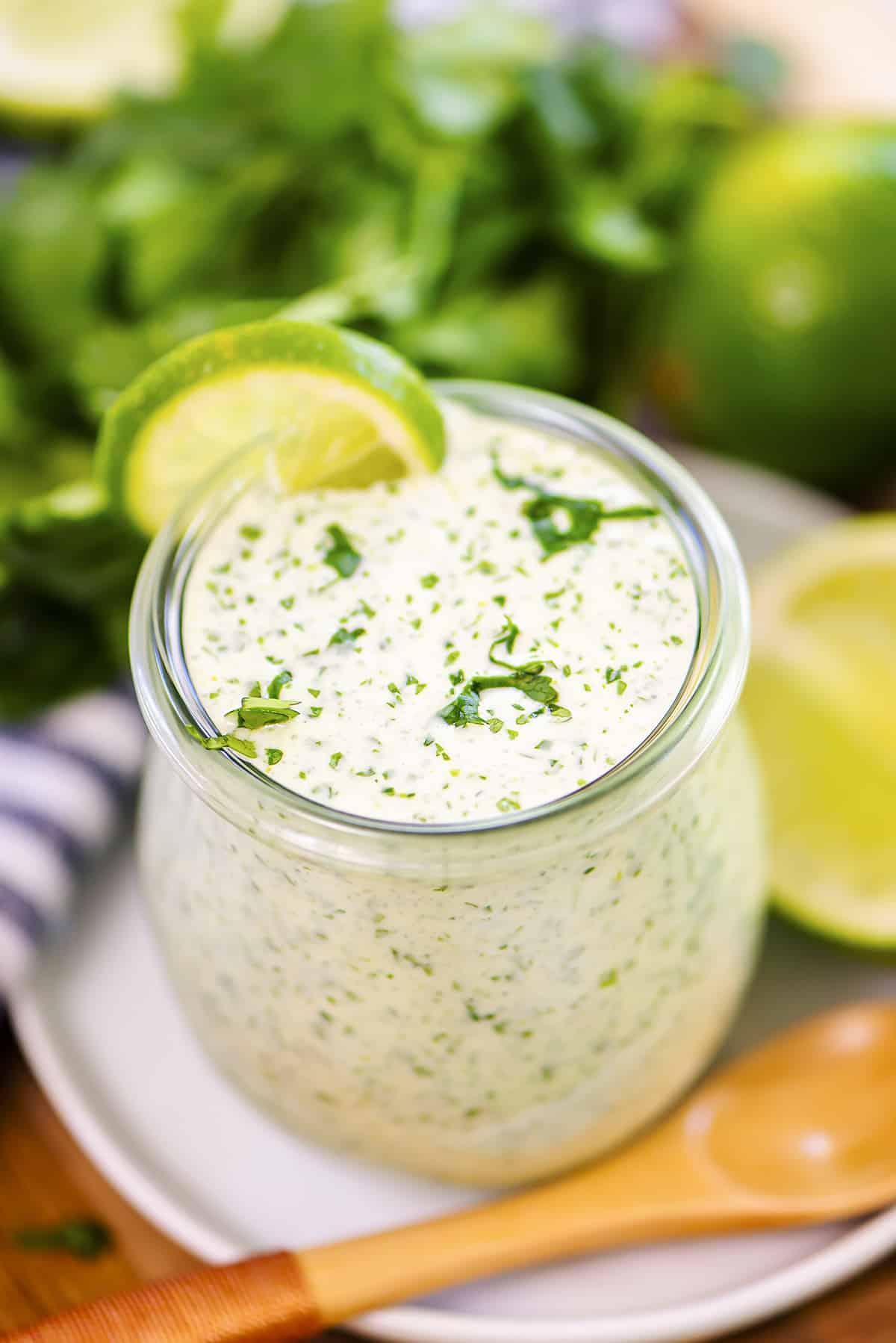 Cilantro lime salad dressing in small jar.