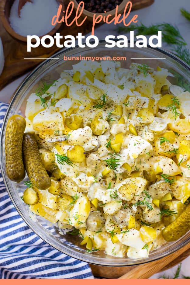 Overhead view of potato salad with dill pickles.