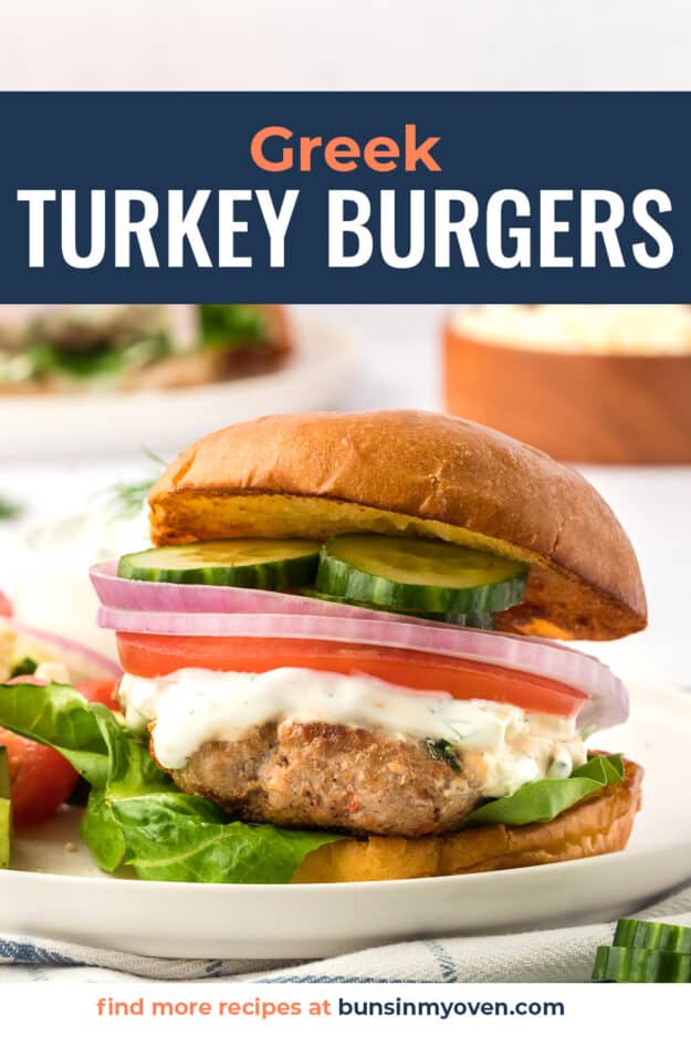 Turkey burger topped with tzatziki and fresh veggies.