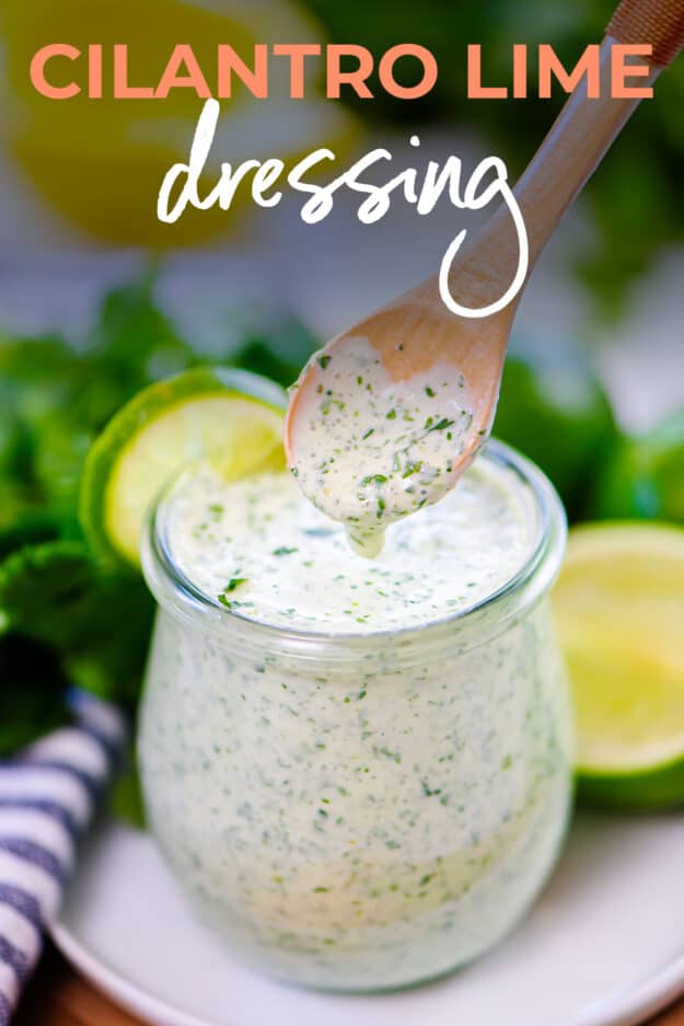 Cilantro lime dressing dripping off a spoon.
