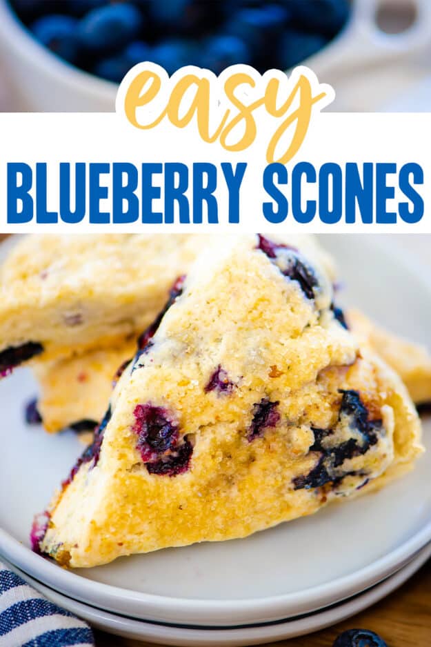 Blueberry scones stacked on plate.
