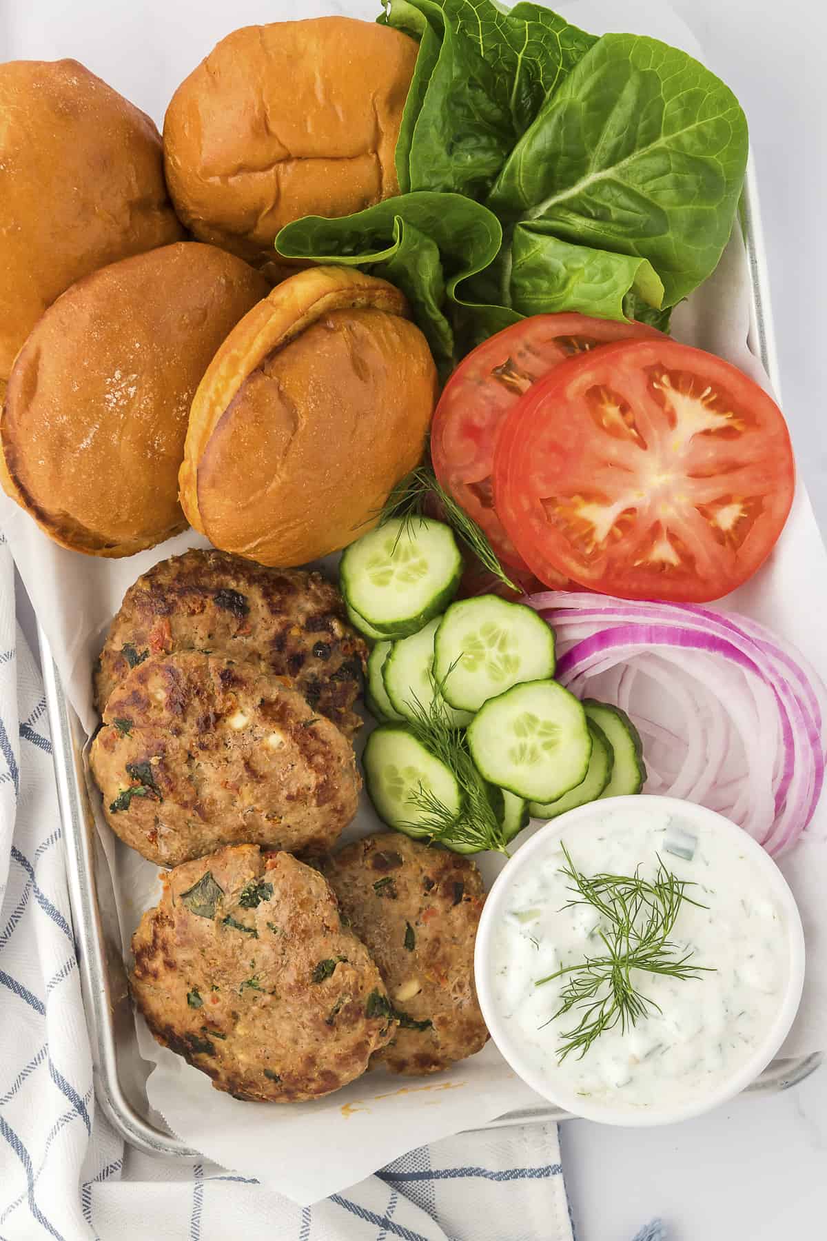 Turkey burgers on serving tray.