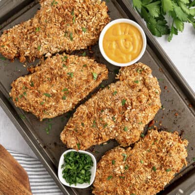 Baked pretzel crusted chicken on sheet pan.
