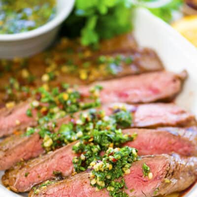 Sliced flank steak topped with cilantro chimichurri.