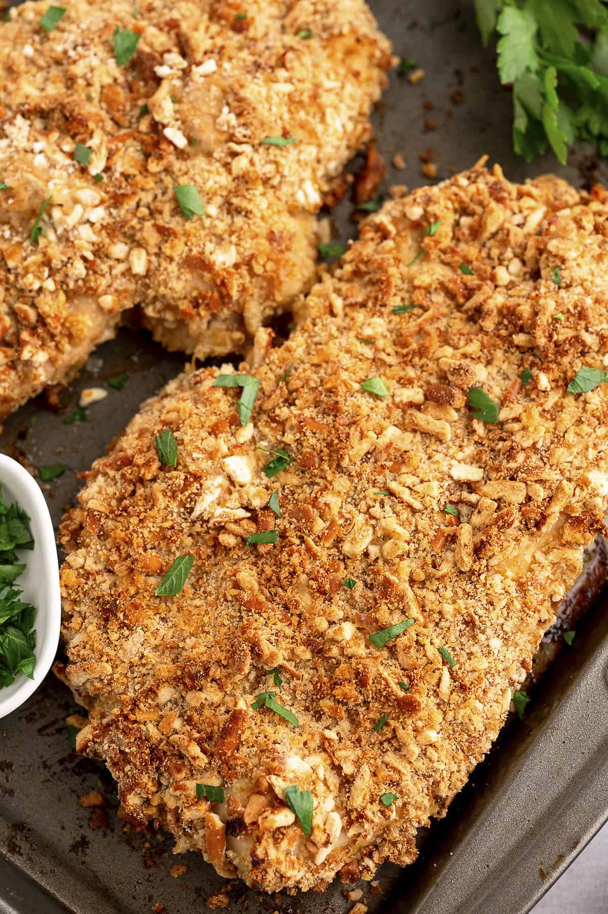 Crispy pretzel chicken on sheet pan.