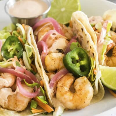 Baja shrimp tacos on plate.