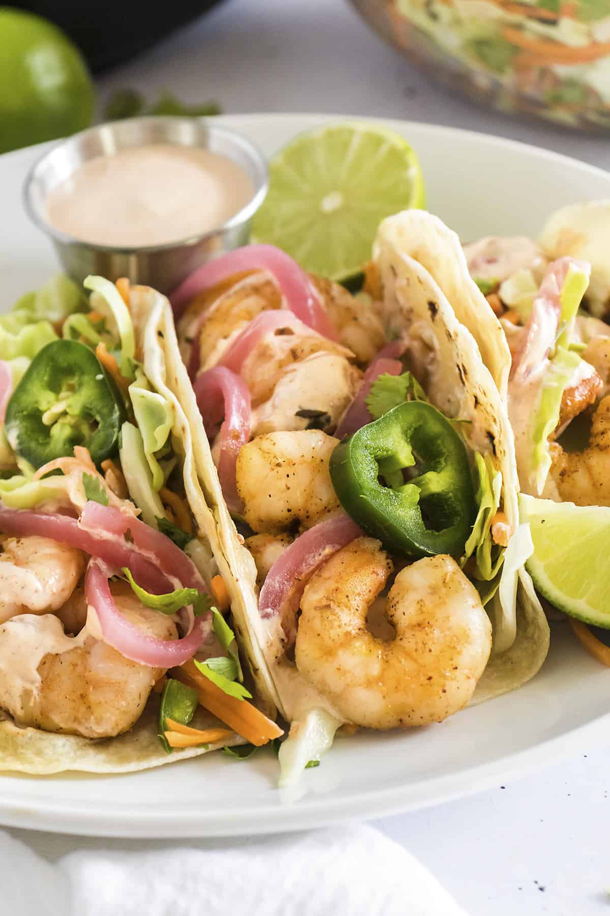 Baja shrimp tacos on plate.