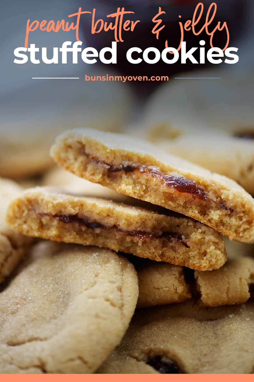 Peanut butter and jelly cookies piled on baking sheet.