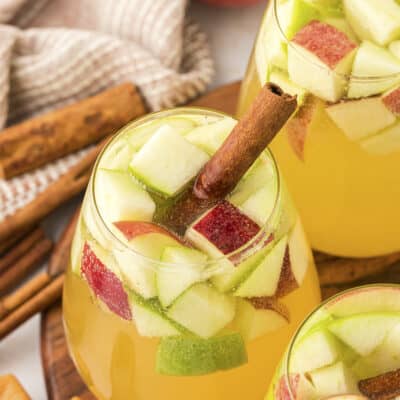 Caramel apple sangria in small glass.