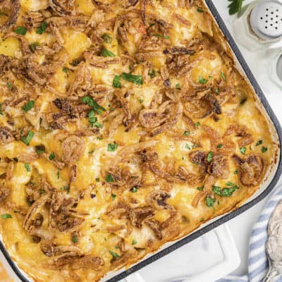 Overhead view of chicken and potato casserole in white baking dish.
