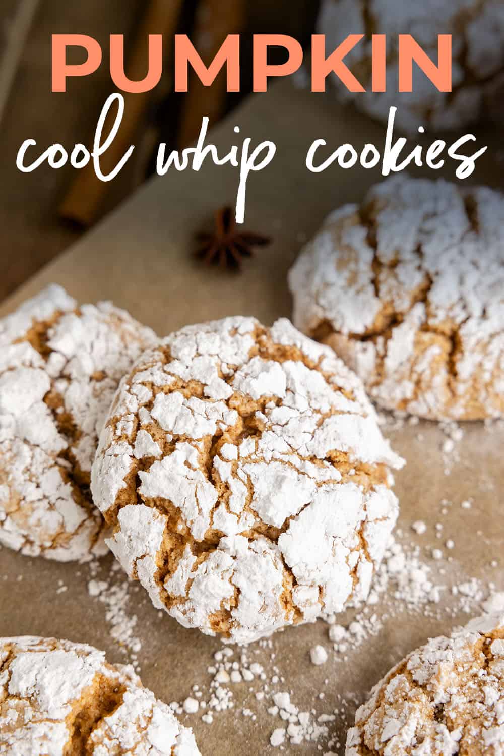 Pumpkin cool whip cookies on parchment paper.