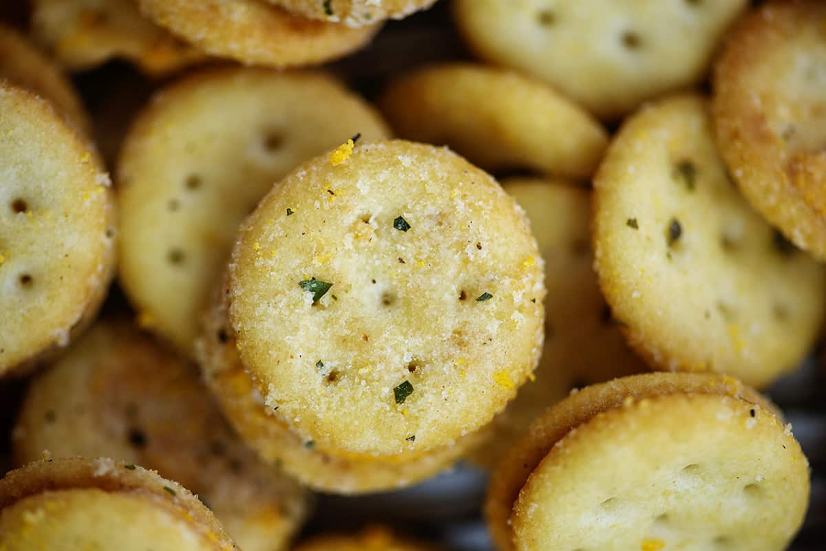 Close up of Ritz bitz crackers coated in ranch.