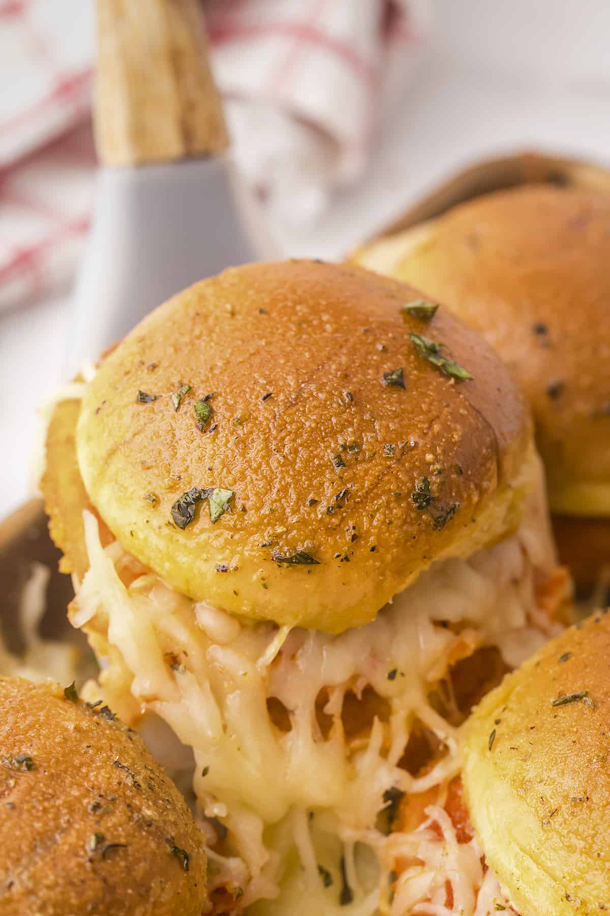 Baked chicken parmesan slider on spatula.