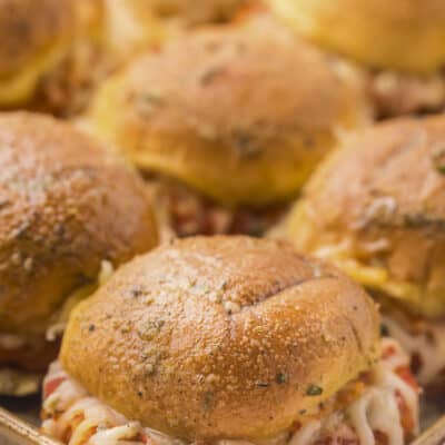 Chicken parmesan sliders on baking sheet.