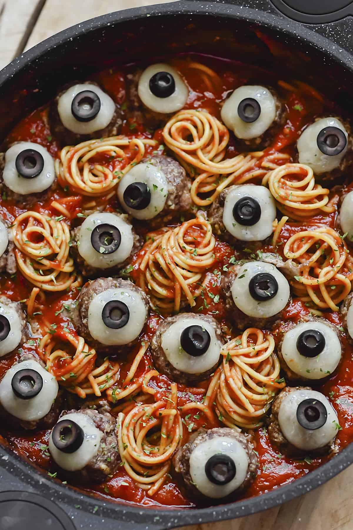 Spooky Halloween spaghetti in pot.