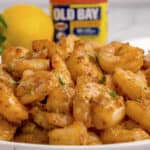 Shrimp stacked on plate.