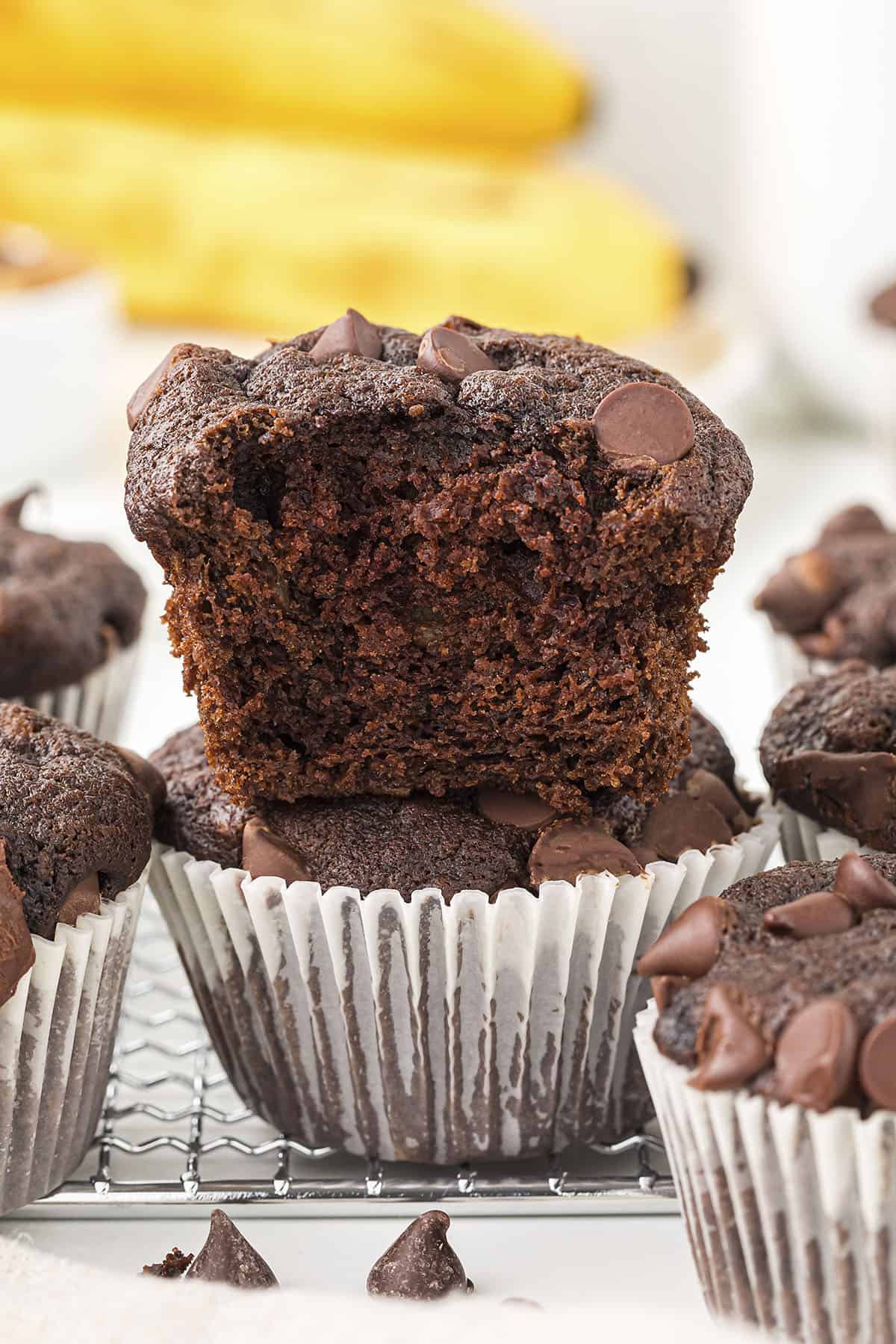 Chocolate banana muffin stacked on top of another muffin.