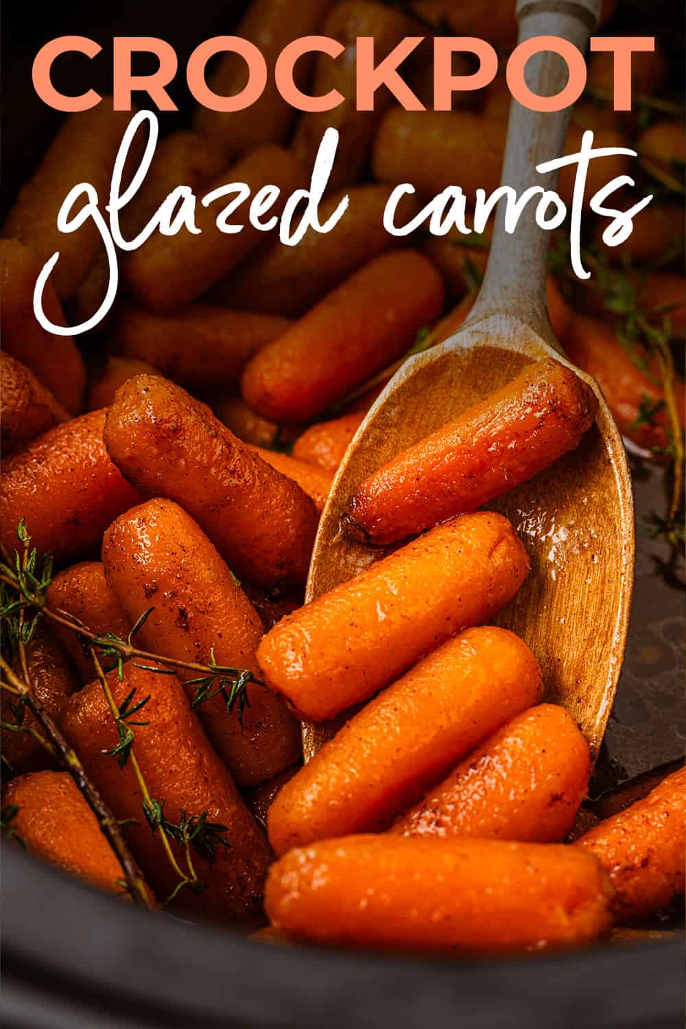 Close up of crockpot carrots on wooden spoon.