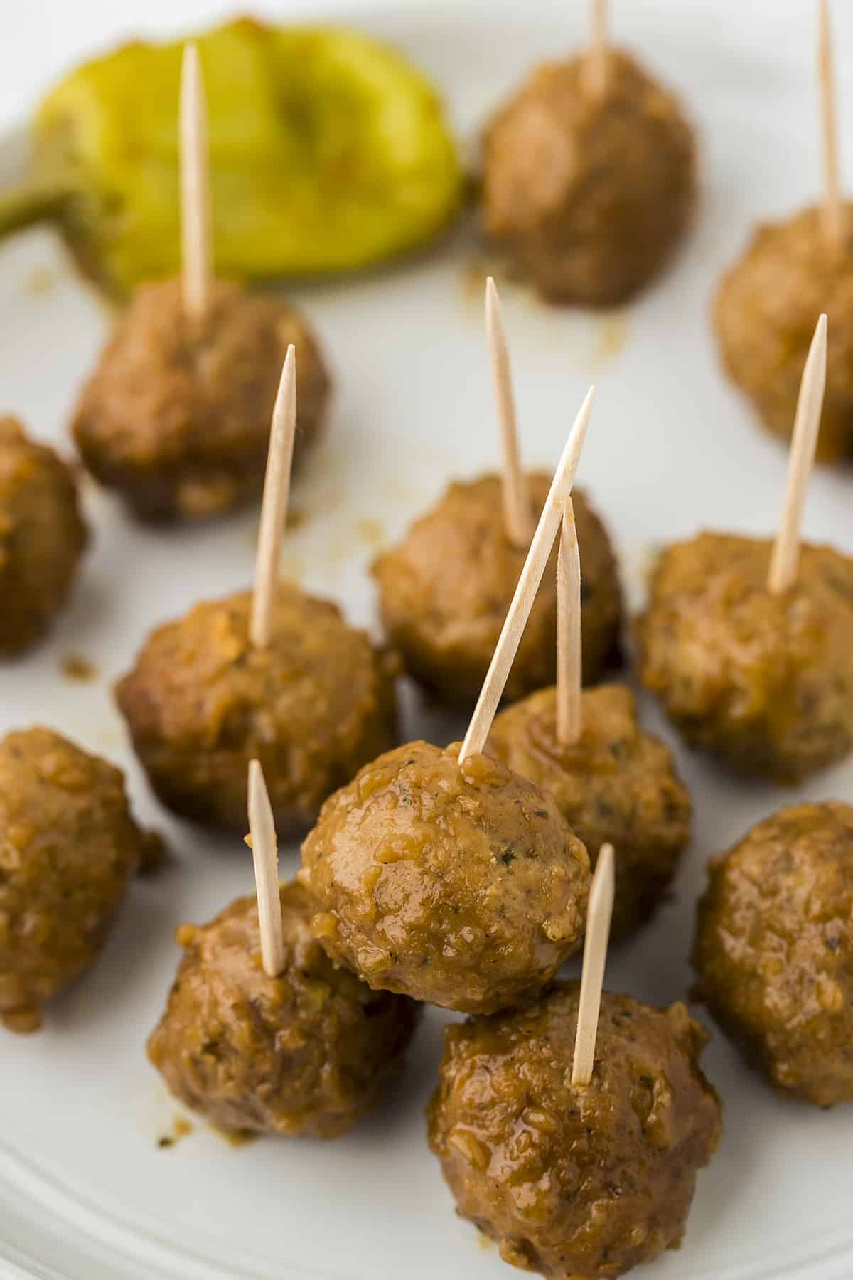 Meatballs with toothpicks stuck in them for serving.