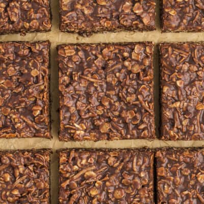 Sliced coconut chocolate bars on parchment paper.