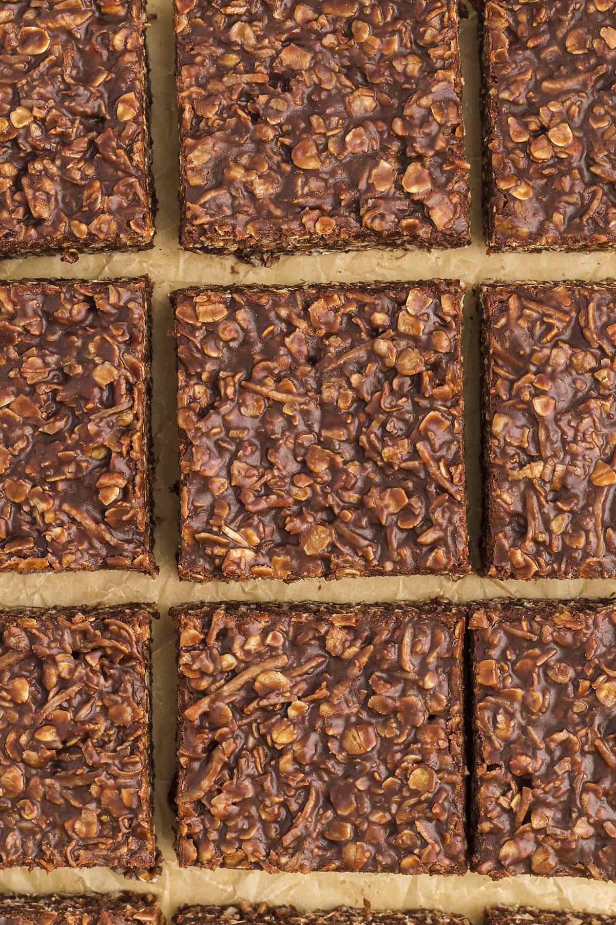 Sliced coconut chocolate bars on parchment paper.